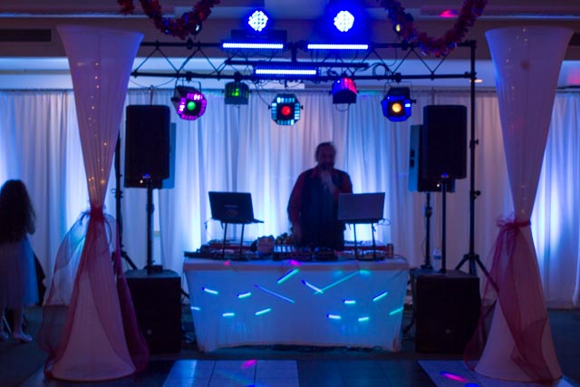 White Curtain walls with up-lighting, mobile marble dance floor, light columns,  club style lighting, and a top of the line sound system...makes for an elegant evening.